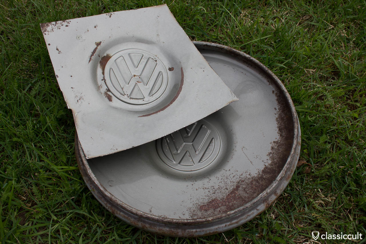 Unrestored VW 1200A 1965 1966 Hubcap in L328 steel grey. The hupcap was mounted on my 1200A Standard when I bought the beetle. I had to cut out the middle of one hubcap to get the hubcap under an electronic paint reader. Unfortunate it was not possible to get the original color code with an electronic paint reader, because the hubcap inside is irregularly painted. 