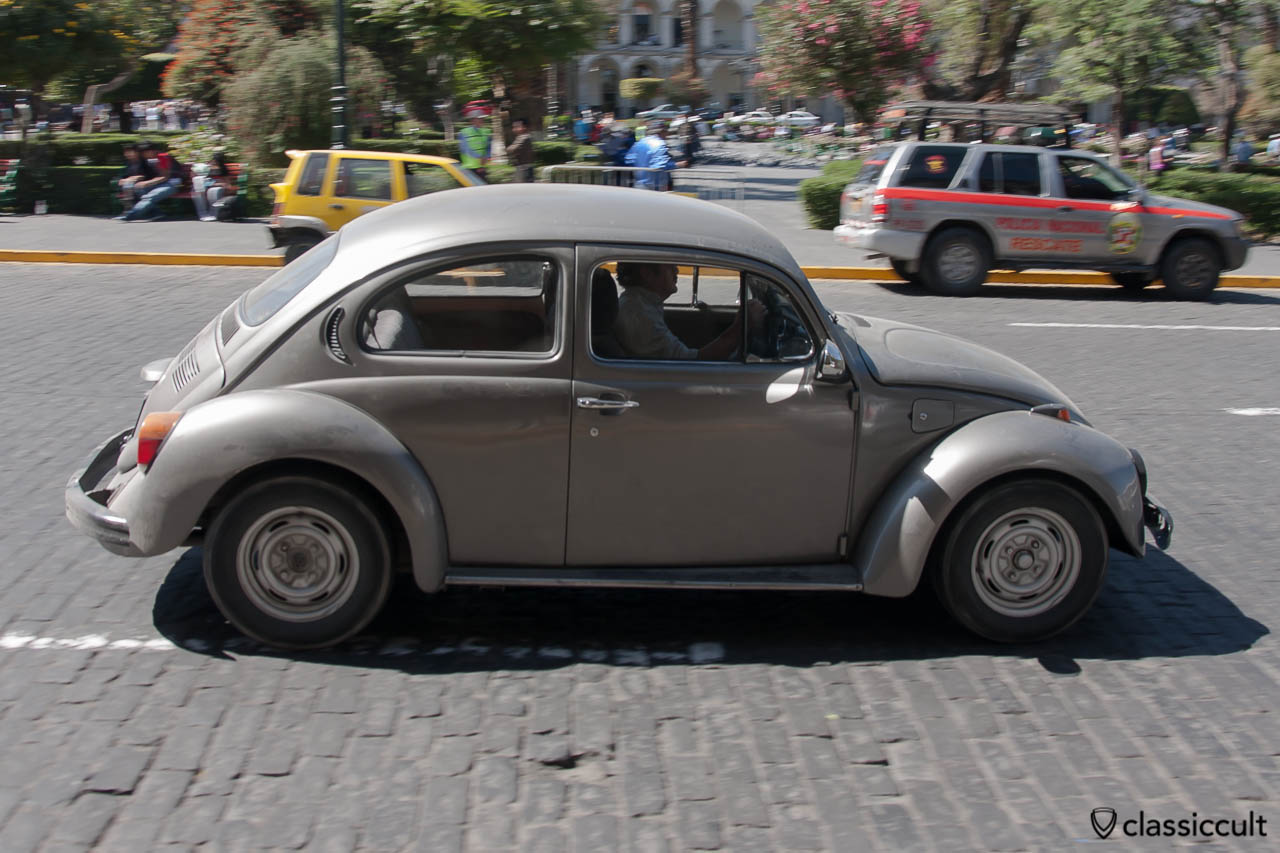 Volkswagen Bug driving around Plaza de Armas of Arequipa, Peru, May 8, 2013