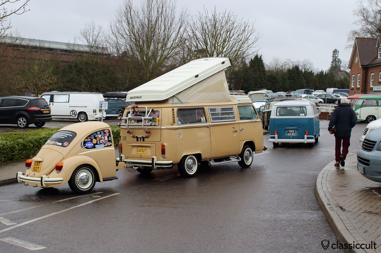 Bay Window Westfalia Bus with VW Beetle trailer, both equipped with bumper guards.