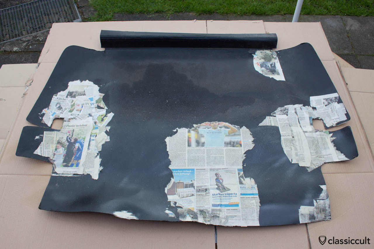 VW 1200A Hardboard trunk liner resto step 1. I put a few layers of newspaper peace’s with spray adhesive at the cracks of both sides of the hardboard trunk liner. 