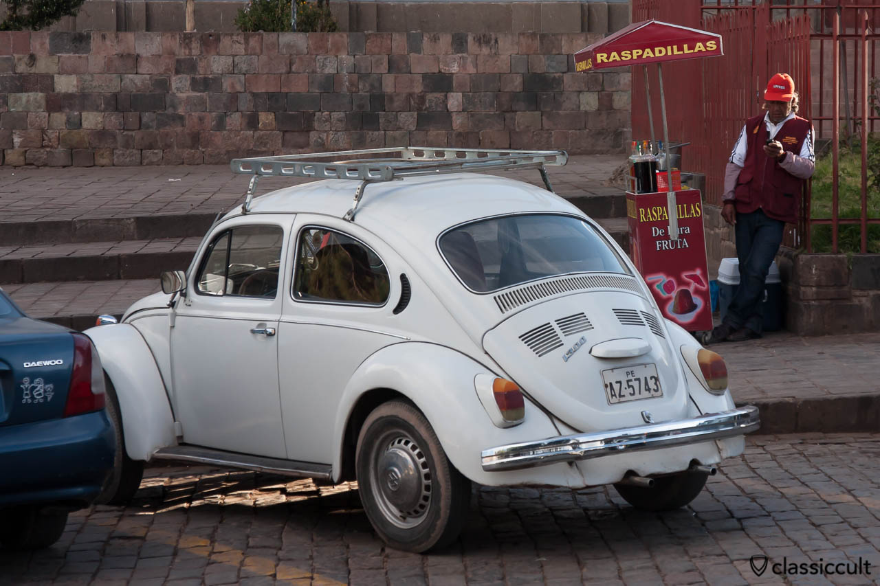 VW 1300 Beetle and a raspadilla snowcone stand in Cuzco, Peru, May 11, 2013