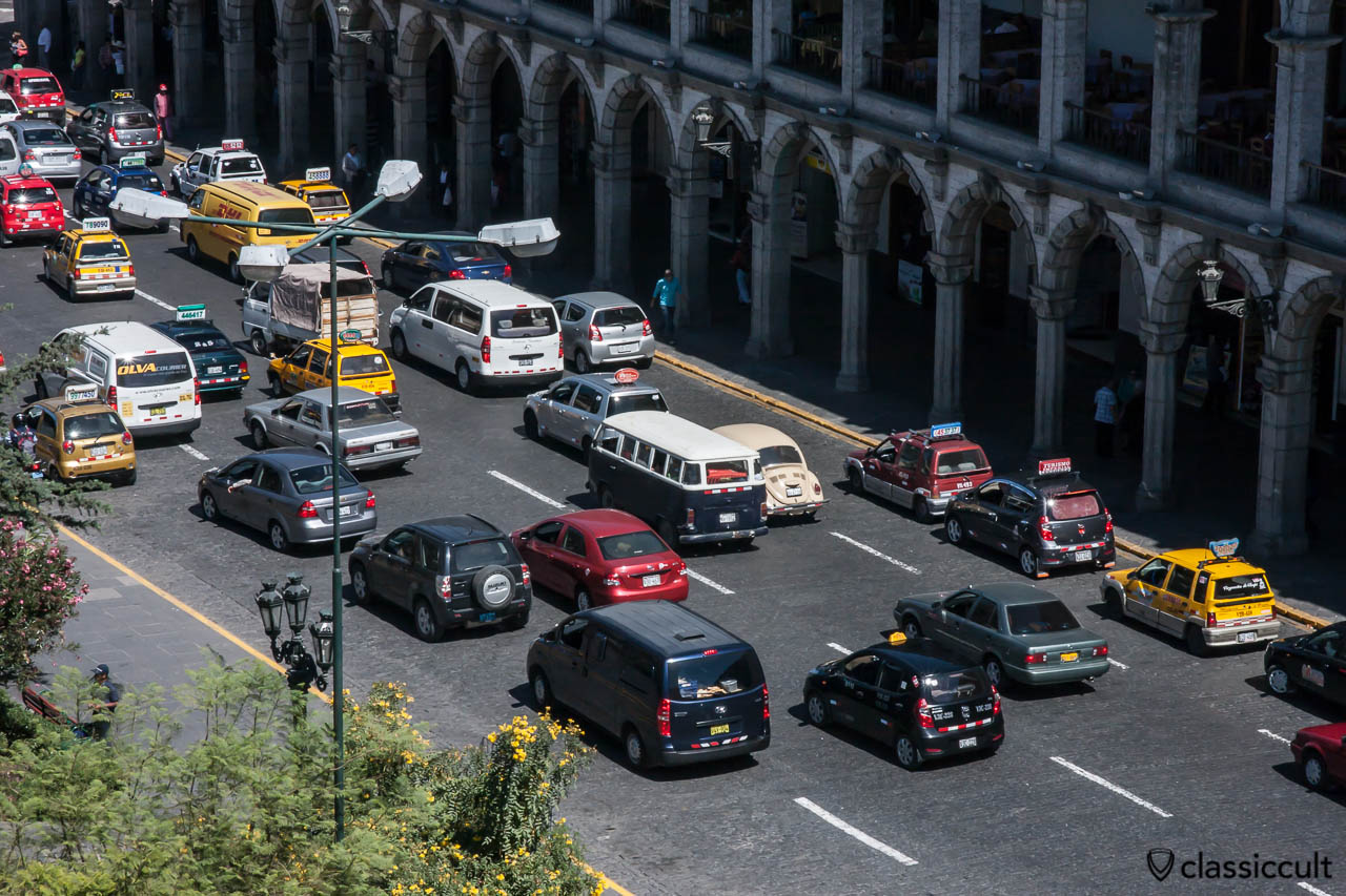 VW Bay Window Bus and Beetle at Plaza de Armas Arequipa, Peru, May 8, 2013. The picture was taken from the top of the Basilica Catedral Arequipa.