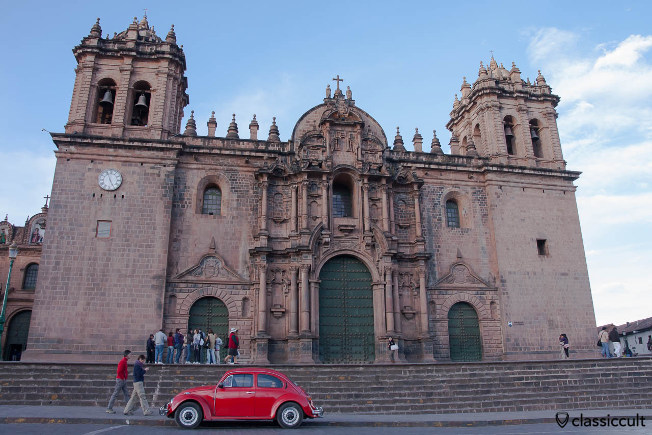 VW Beetle in front of the Cathedral of Santo Domingo, Cusco, Peru, May 11, 2013