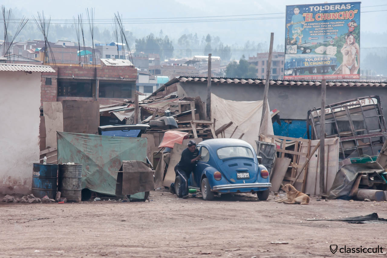 Peruvian pushes his VW Beetle seen from Cuzco to Puno train, Peru, May 15, 2013.