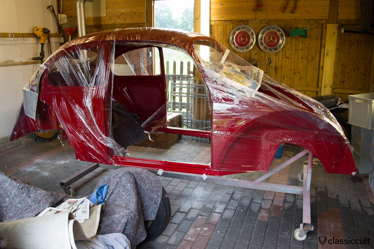 VW Bug in packaging film getting Mike Sanders rust prevention grease. I put Mike Sanders corrosion protection in the heater channels and in the areas where the beetles tend to rust. 
