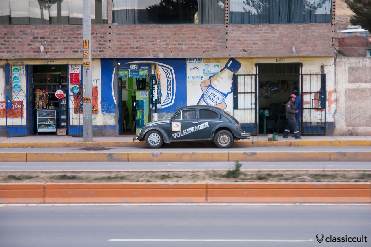 VW Bug and Inca Kola Advertisement seen from Andean Explorer, Peru, May 15, 2013