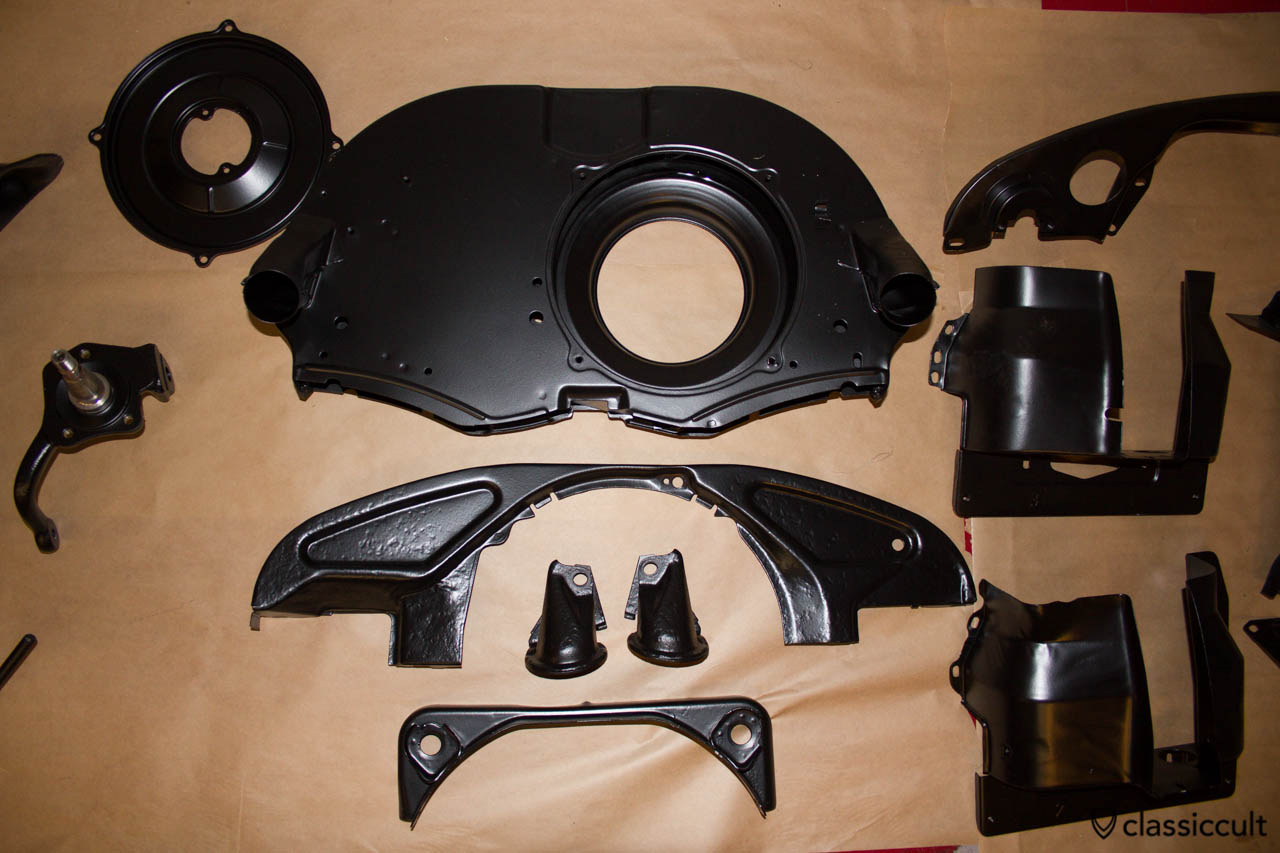 VW Bug motor paneling black painted.
