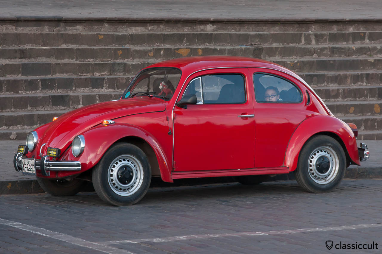 VW Bug with fog lights parking on Plaza de Armas in Cuzco, Peru, May 11, 2013